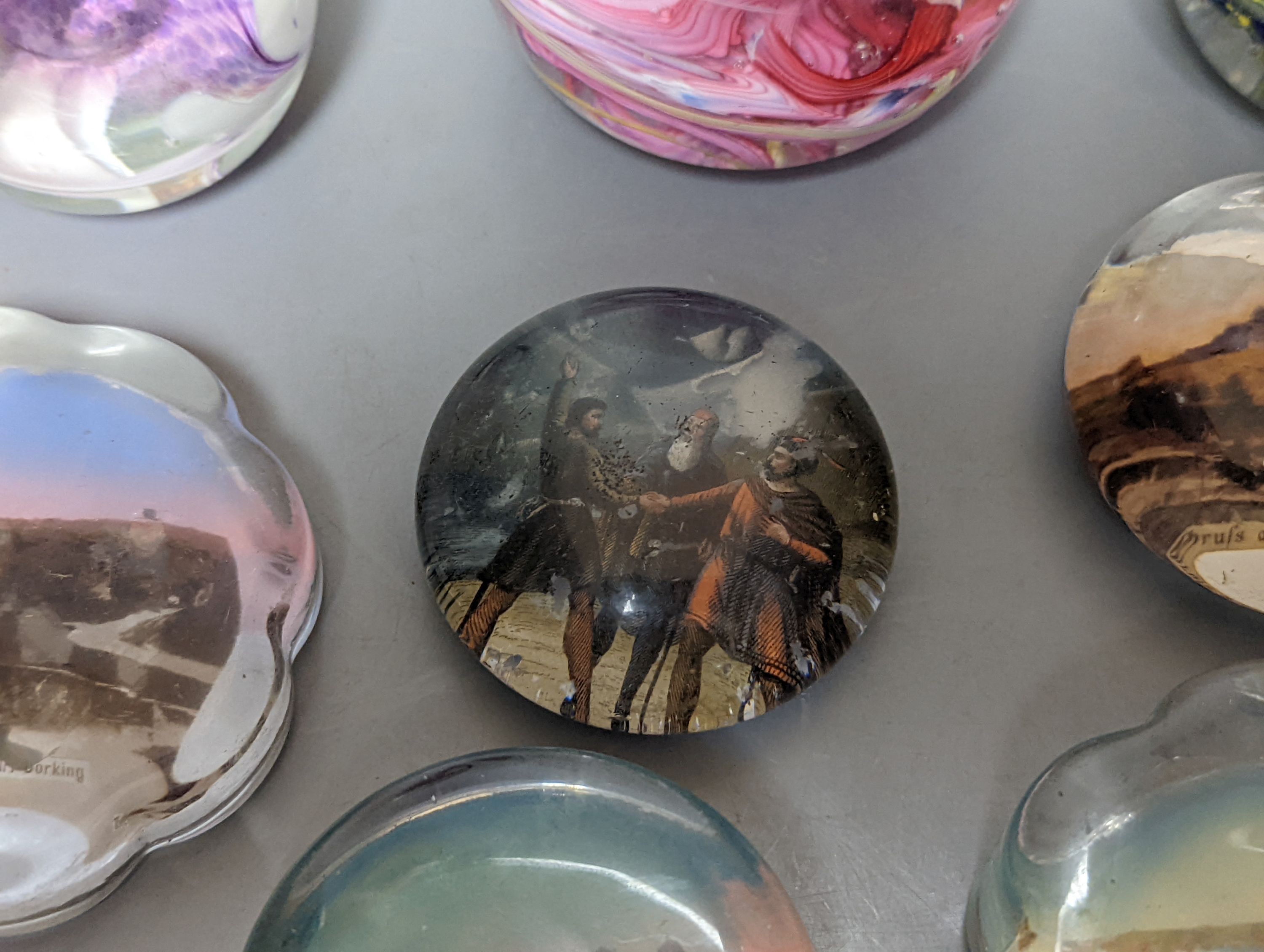 Nine various glass paperweights